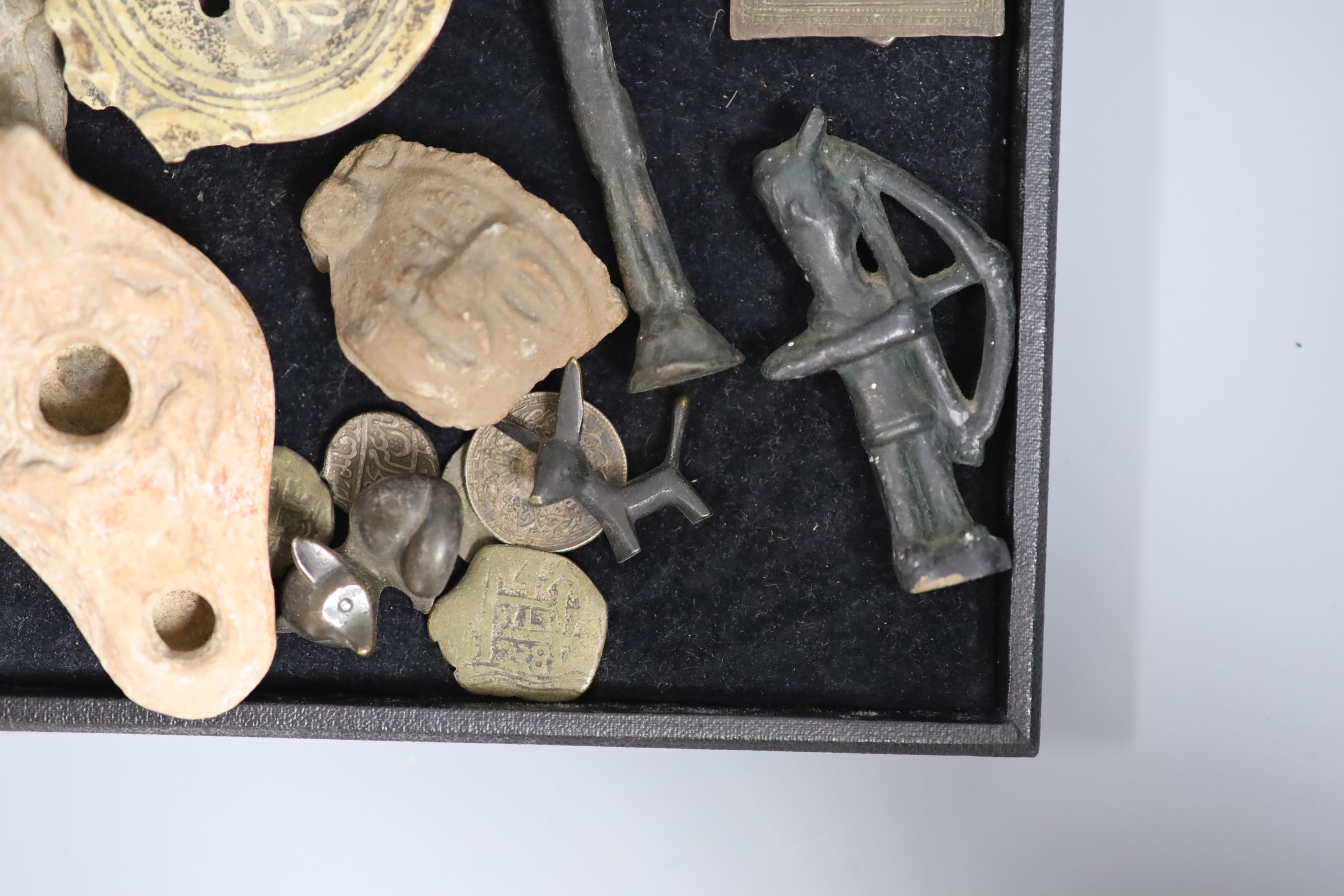 A group of curios including three pre-Columbian pottery fragments, Islamic coins and amulets, etc